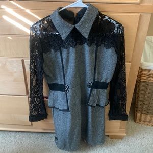 Classy black lace sleeved cocktail or business party dress.